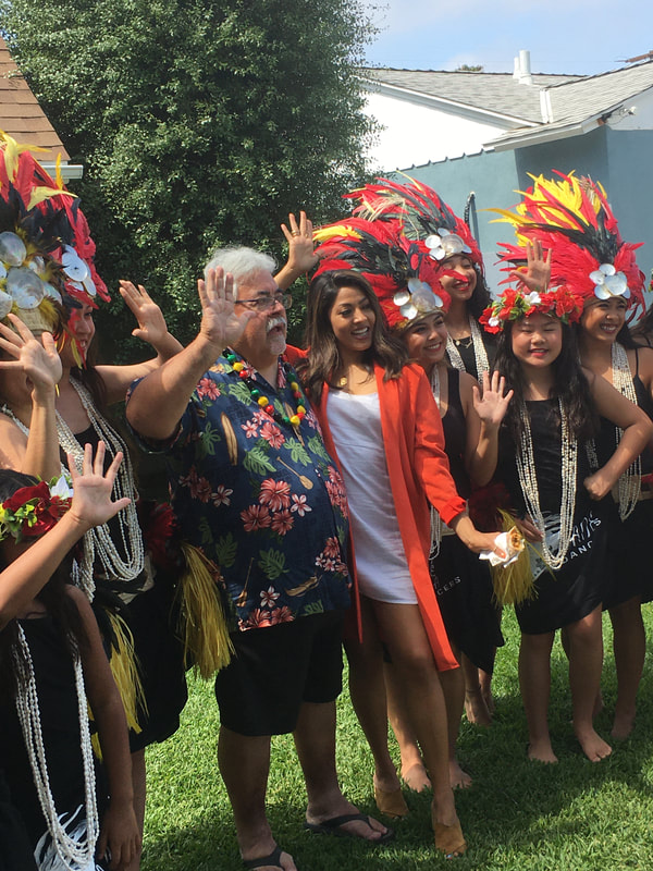 Luau party guests feathered headdresses celebration