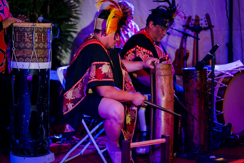 Polynesian drummers percussion performance stage lighting