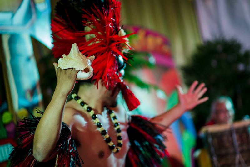 Carnival festival performer feathered headdress luau