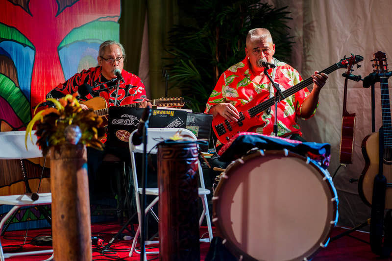 Hawaiian musicians guitar bass performers tropical stage